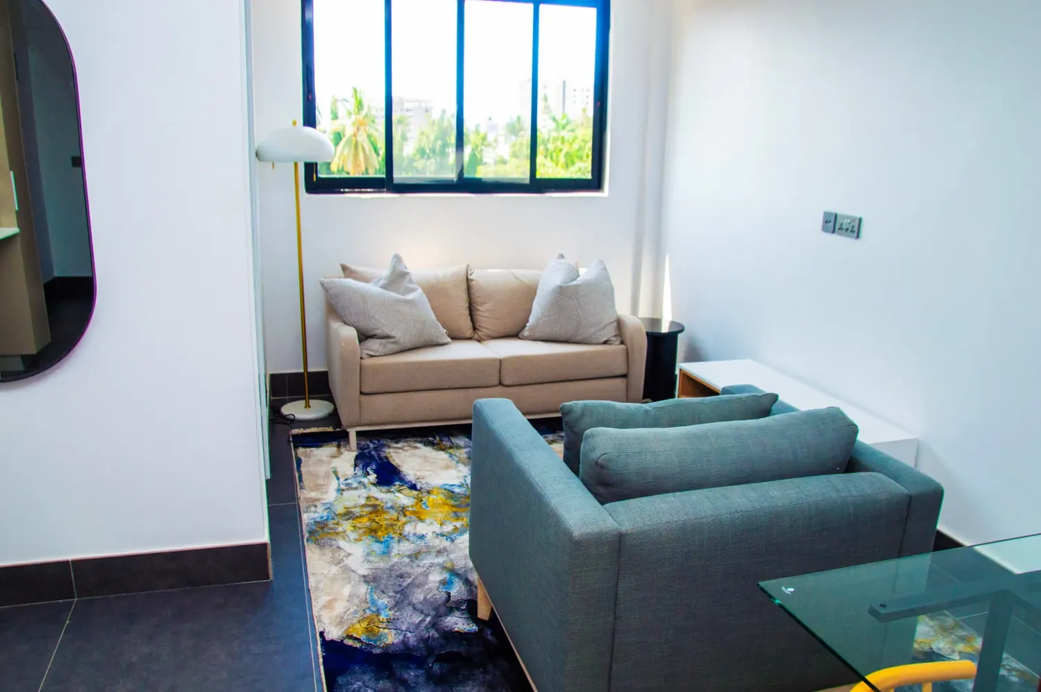 Furnished living room at Urambo Suites